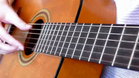 Playing On An Acoustic Guitar Stock Footage 56299960