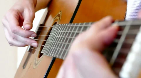 Playing On An Acoustic Guitar Stock Footage 56300030