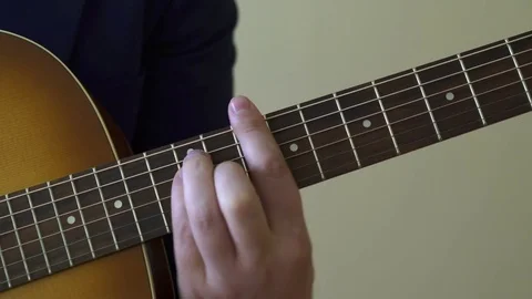 Playing acoustic guitar Stock Footage 73578181