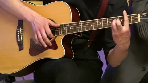 Playing on the acoustic guitar. Stock Footage 75083559