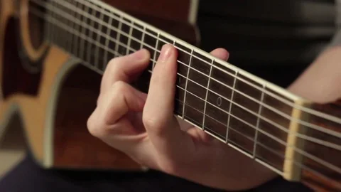 Playing on the acoustic guitar. Musical instrument with guitarist hands Stock-Footage 70851753