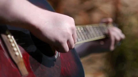 Playing Acoustic Guitar (Pull Focus) Stock Footage 37057676