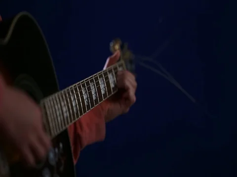 Playing acoustic guitar Side angle with focus on fretboard Stock Footage 80321348