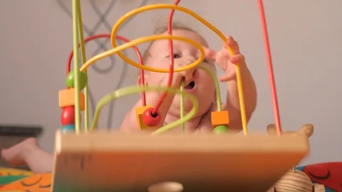 Playing activity for toddler. Developing fine motor skills background. Fine Stock Footage 101387810