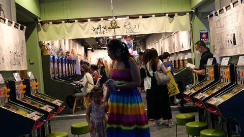 Playing arcade games, Ximending Stock Footage 275941888