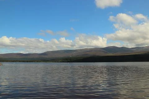 Playing around Loch Morlich in the sun Stock Photos
