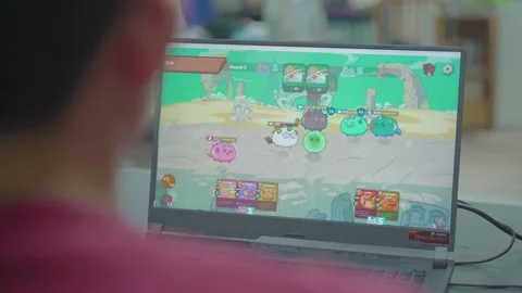 Playing Axie Infinity NFT-based Online Video Game Stock Footage 160544529