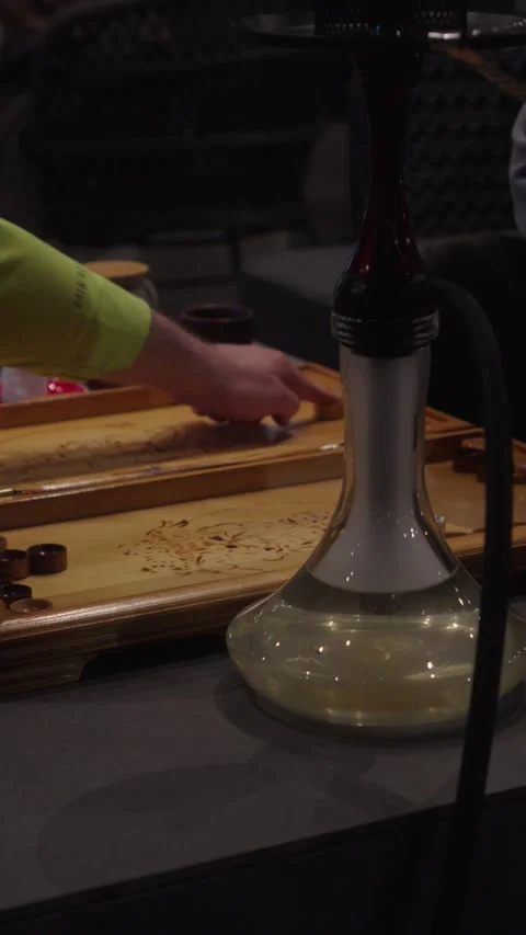 Playing Backgammon With Hookah in Lounge Interior Stock Footage 335944312