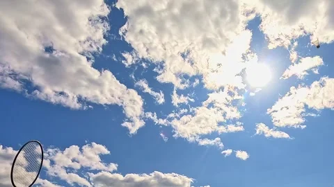 Playing badminton under bright summer sky Video stock 322684162
