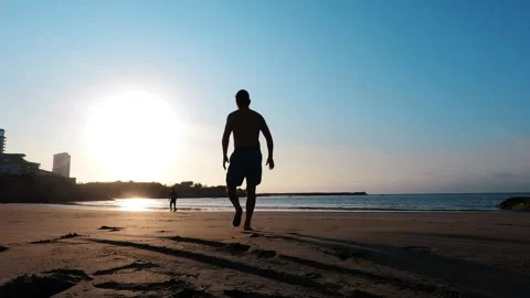 Playing ball on the beach Stock Footage 280082786