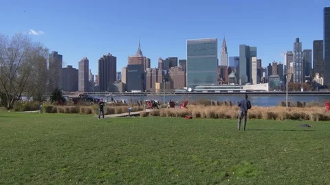 Playing Baseball Catch In Park With Manhattan View Video stock 82764352