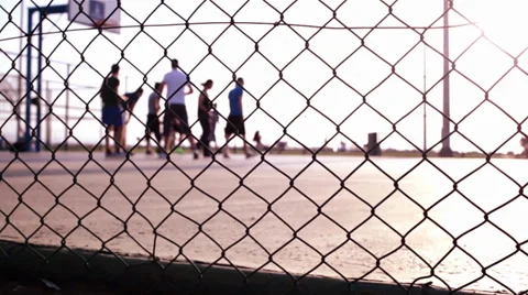 Playing Basketball ,In The Sunset,Behind The Wire Mash Stock Footage 37507535