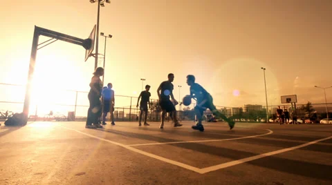 Playing Basketball ,In The Sunset,Behind The Wire Mash  Stock Footage