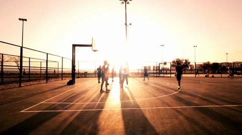 Playing Basketball ,In The Sunset,Behind The Wire Mash Stock Footage