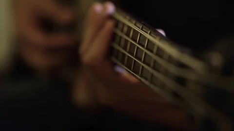 Playing bass guitar close up Stock Footage 101576465