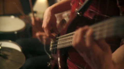 Playing Bass Guitar with Drums in Background Stock Footage 49539528