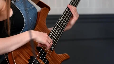 Playing bass guitar Stock Footage 317958799