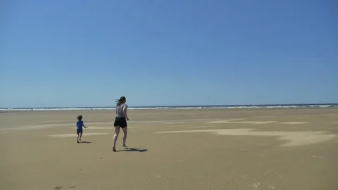 Playing on the beach Stock Footage 83629292