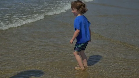 Playing on the beach Stock Footage 83629351