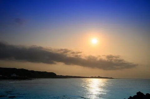 Playing in the beach, looking for fish and crabs, watching the sunset. Stock Photos