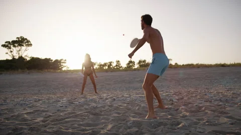 Playing With Beach Paddles On The Sand Stock Footage 246669417