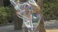 Playing with big soap bubbles in Barcelona 4k or 4k+ Resolution