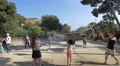 Playing with big soap bubbles in Park Guell in Barcelona 4k or 4k+ Resolution