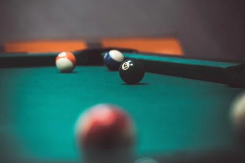 Playing biliard in a pool Stock Photos