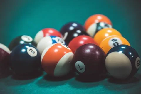 Playing biliard in a pool Stock Photos