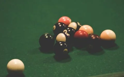 Playing biliard in a pool Stock Photos