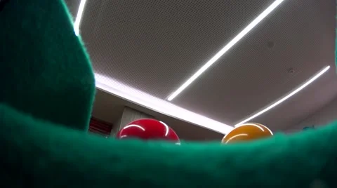 Playing billiard (snooker)/Pool player, balls goes through the hole Stock-Footage 64315973