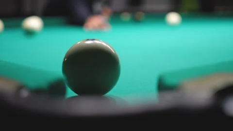 Playing Billiards and Getting the Ball into the Pocket Slow Mo Stock Footage 284420075