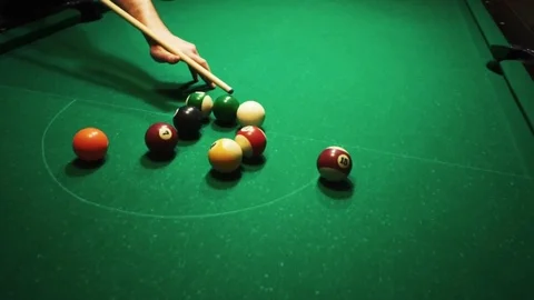 Playing billiards, blowing a cue on the ball, the ball hit the pocket, the ball Stock Footage 77134688