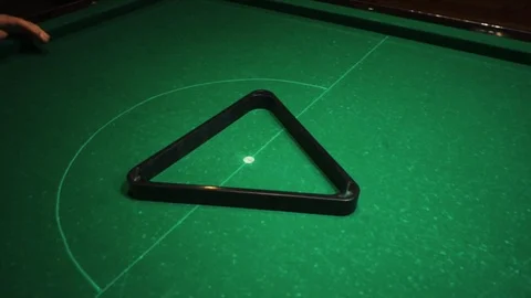 Playing billiards, blowing a cue on the ball, the ball hit the pocket, the ball Stock Footage 77149185