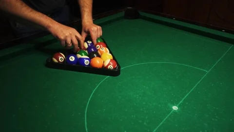 Playing billiards, blowing a cue on the ball, the ball hit the pocket, the ball Stock Footage 77149668