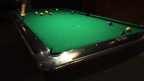 Playing billiards, blowing a cue on the ball, the ball hit the pocket, the ball Stock Footage 77150932