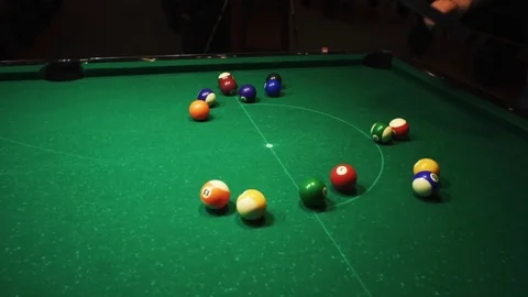 Playing billiards, blowing a cue on the ball, the ball hit the pocket, the ball Stock Footage 77277501