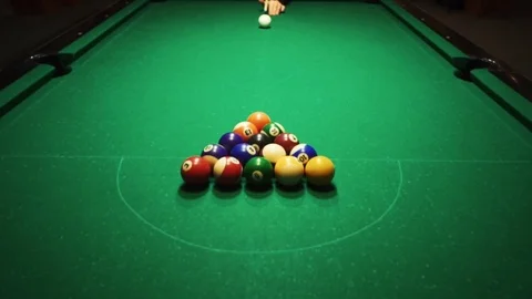 Playing billiards, blowing a cue on the ball, the ball hit the pocket, the ball Stock Footage 77277814