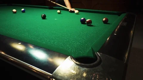 Playing billiards, blowing a cue on the ball, the ball hit the pocket, the ball Stock Footage 77278227