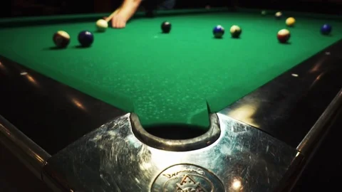 Playing billiards, blowing a cue on the ball, the ball hit the pocket, the ball Stock Footage 77278284
