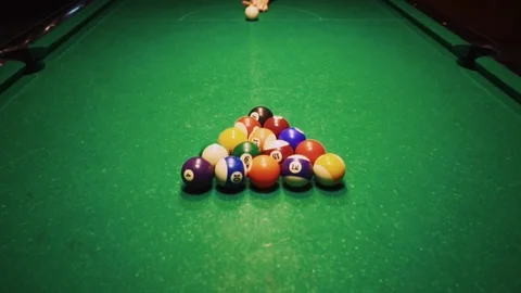 Playing billiards, blowing a cue on the ball, the ball hit the pocket, the ball Stock Footage 77278332