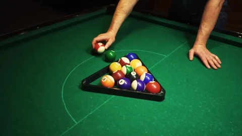 Playing billiards, blowing a cue on the ball, the ball hit the pocket, the ball Stock Footage 77279581