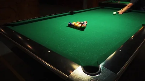 Playing billiards, blowing a cue on the ball, the ball hit the pocket, the ball Stock Footage 77279973