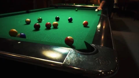Playing billiards, blowing a cue on the ball, the ball hit the pocket, the ball Vidéo 77280990