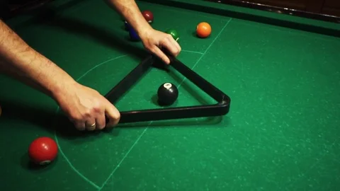 Playing billiards, blowing a cue on the ball, the ball hit the pocket, the ball Stock Footage 77281769