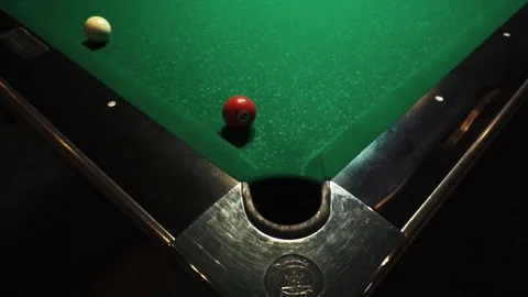 Playing billiards, blowing a cue on the ball, the ball hit the pocket, the ball Stock Footage 77282268