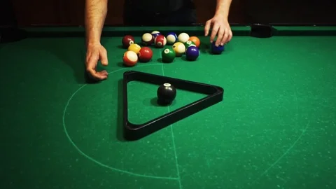 Playing billiards, blowing a cue on the ball, the ball hit the pocket, the ball Stock Footage 77283077
