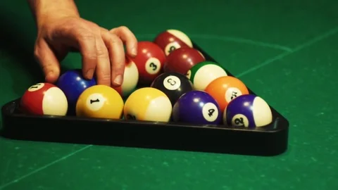 Playing billiards, blowing a cue on the ball, the ball hit the pocket, the ball Stock Footage 77283313