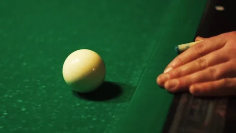 Playing billiards, blowing a cue on the ball, the ball hit the pocket, the ball Stock Footage 77283594