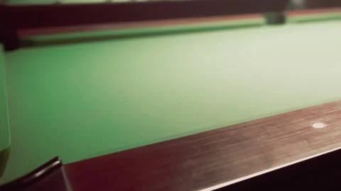 Playing Billiards on a Classic Table in a Cozy Lounge Setting at Dusk Stock Footage 346694048